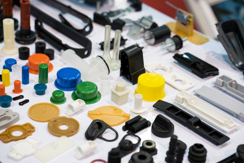 Plastic products displayed on a table to show the capabilities of what a plastic injection molding company can manufacture.